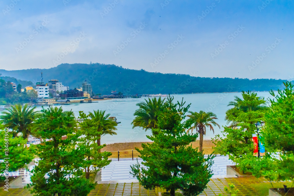 Beautiful Landscape of Sun Moon Lake in the morning with blue mountain background at Nantou, Taiwan