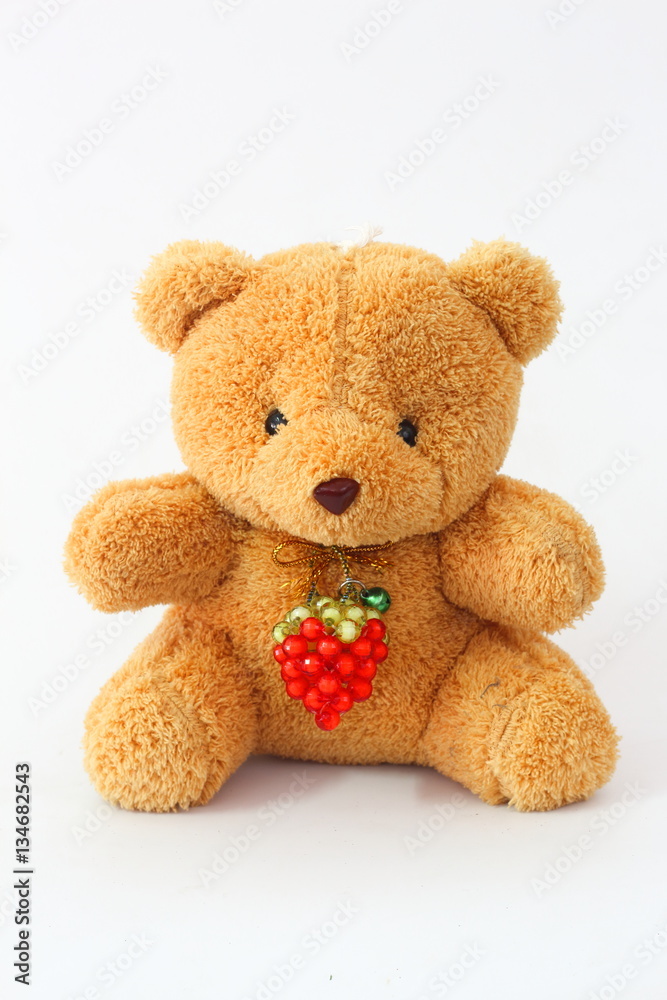 Brown teddy bear on a white background.