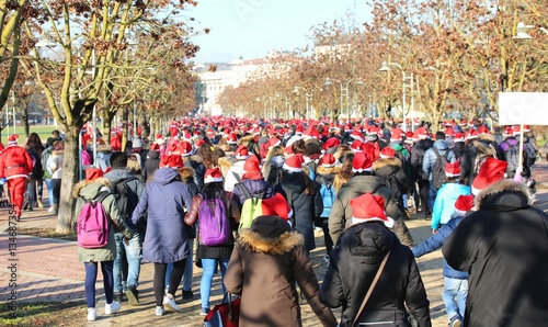 many people dressed as Santa Claus during the event called Runni