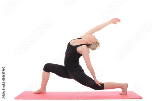 young yoga female doing yogatic exercise photo
