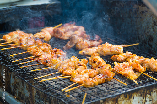 Chicken grill over the small flame.