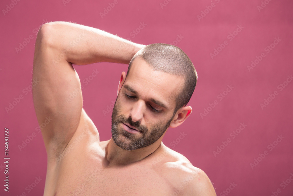 young man handsome shirtless, pink background closeup arms face young man handsome shirtless, pink background closeup arms face