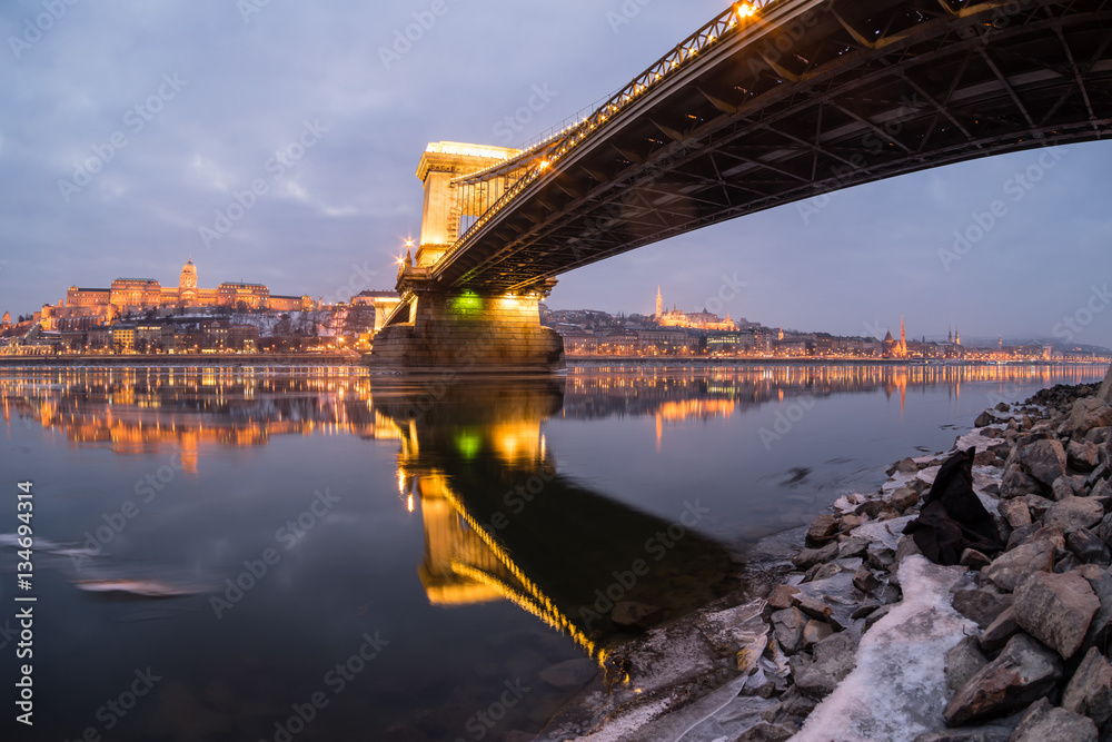 Fototapeta premium Ice flowing on river Danube at night