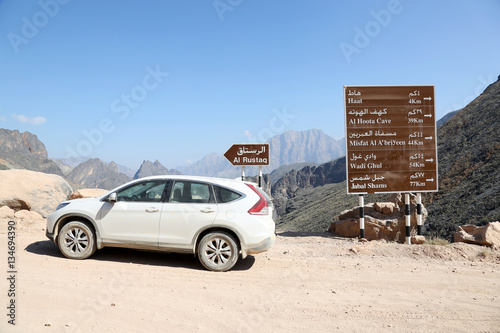 Signpost in the Wadi Bani Awf, Oman photo