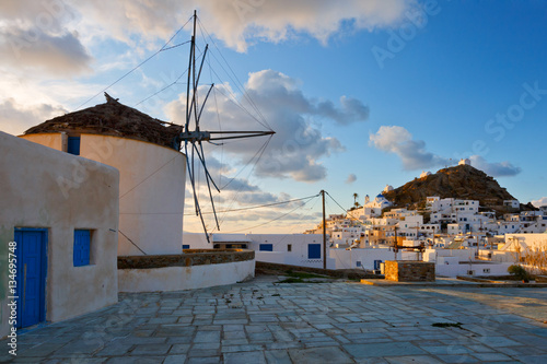 Windmill in Chora of Ios island at sunset.