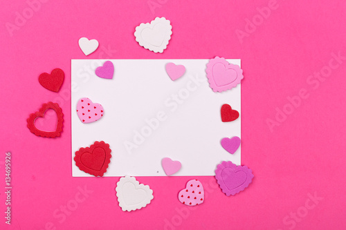 Photo frame or gift card with valentines heart shaped ribbon ove