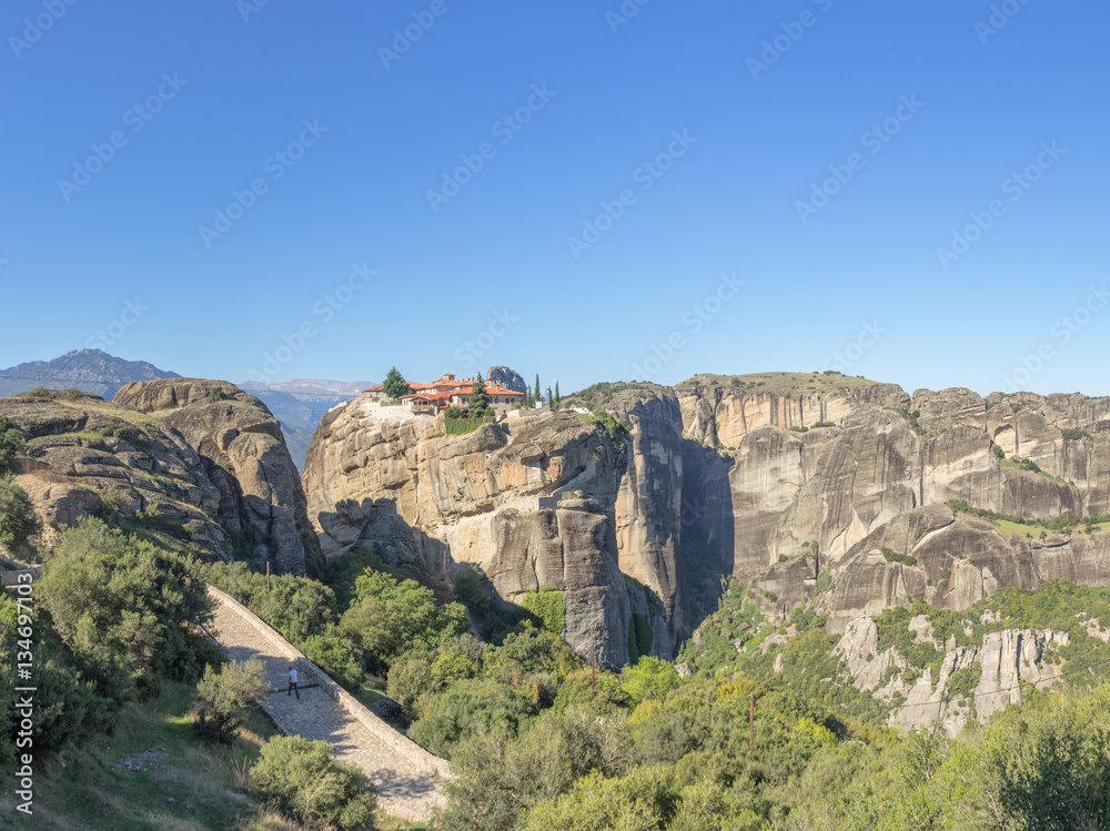 Panoramic view on Holy Trinity Meteora monastery on rocks. Thessaly, Greece.
