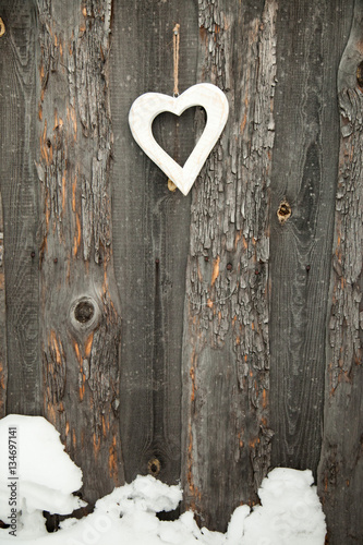 White heart on rustic wooden background