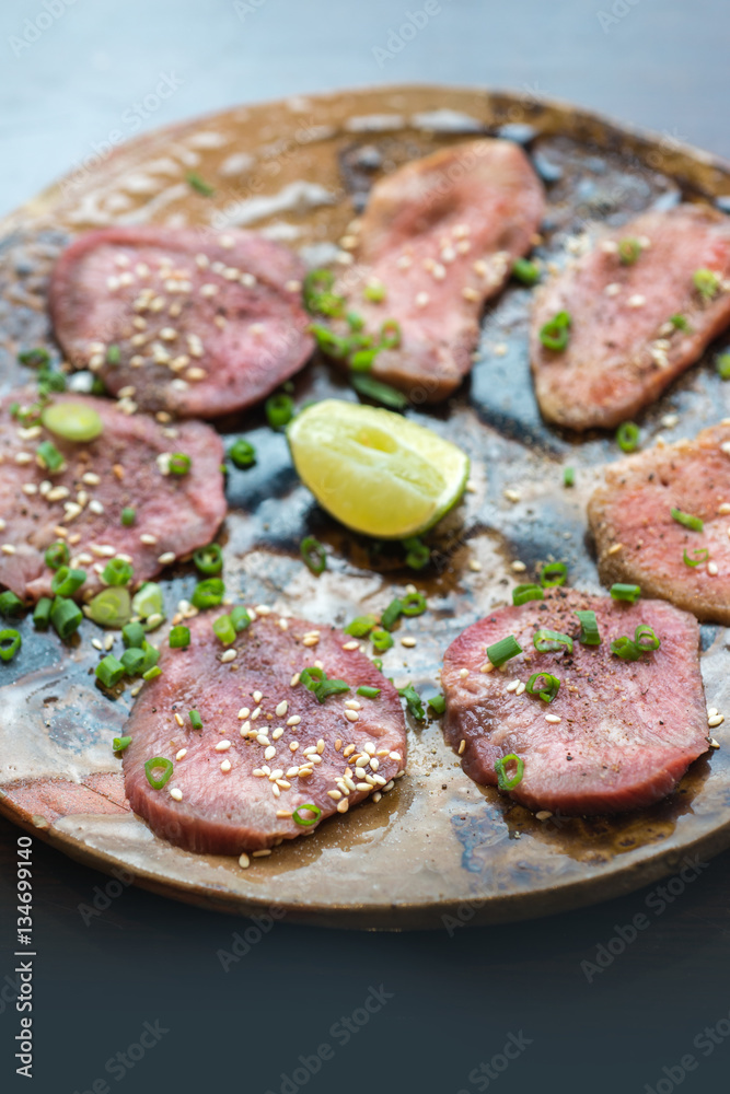Barbecue sliced beef tongue marinated in pepper, onion, sesame oil and soy sauce. Barbecue sliced beef tongue marinated in pepper, onion, sesame oil and soy sauce.