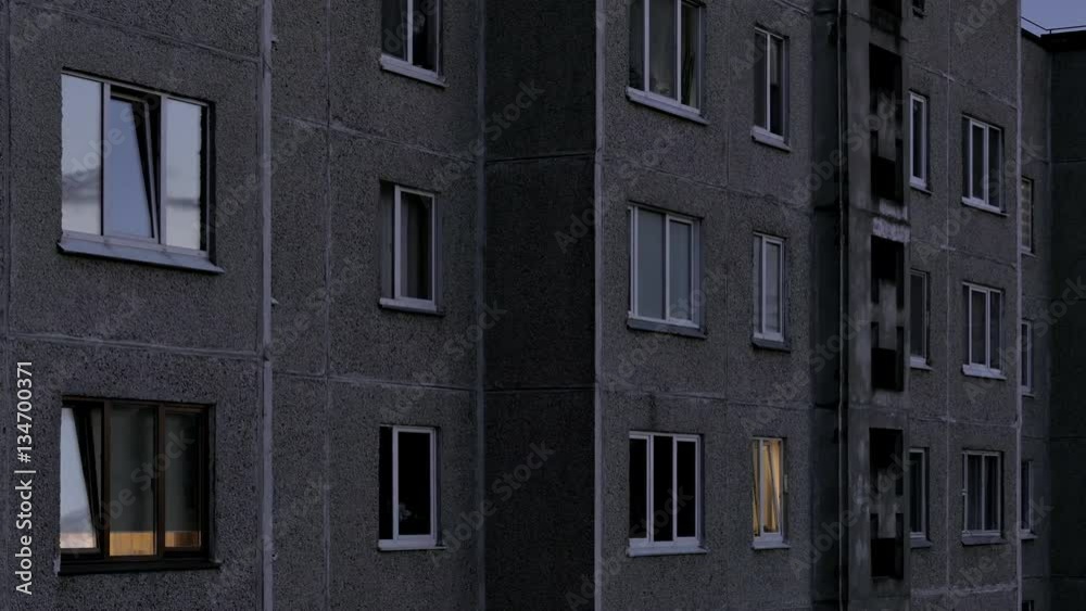 Time lapse of windows of multistory apartment house after sunset. Tenants turn on the lights in their apartments. Time lapse of windows of multistory apartment house after sunset. Tenants turn on the lights in their apartments.