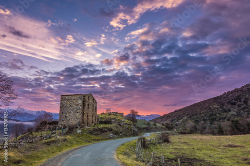 Dawn breaking over old farm building in Corsica