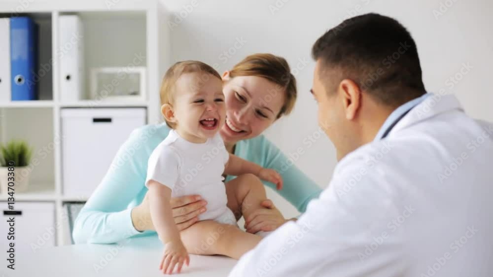 happy woman with baby and doctor at clinic happy woman with baby and doctor at clinic