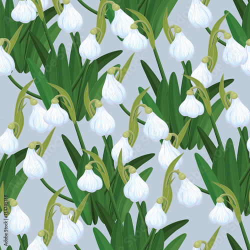 Seamless pattern with snowdrops in the snow. Vector illustration