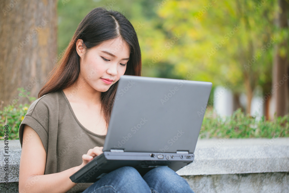 working lifestyle, closeup business woman or student teen using on laptop at outdoor working lifestyle, closeup business woman or student teen using on laptop at outdoor