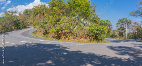 sharp curve u-turn road up hill to the mountain at Doi Suthep Chiangmai Thailand.