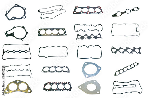 A large set of gaskets for the engine of a passenger car. Separated on a white background. Spare auto parts for shop, aftermarket OEM. Isolated set for repairs.