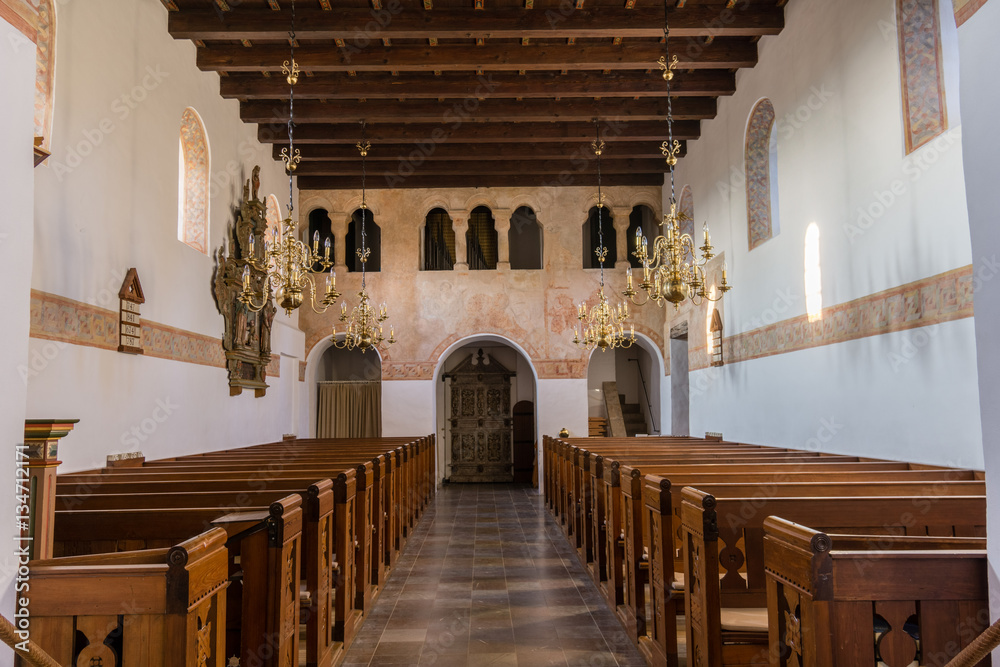 Interior of a medieval church with an arcade for gentlefolk