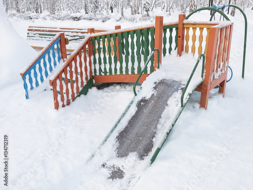 Playground covered with snow in a sanatorium photo