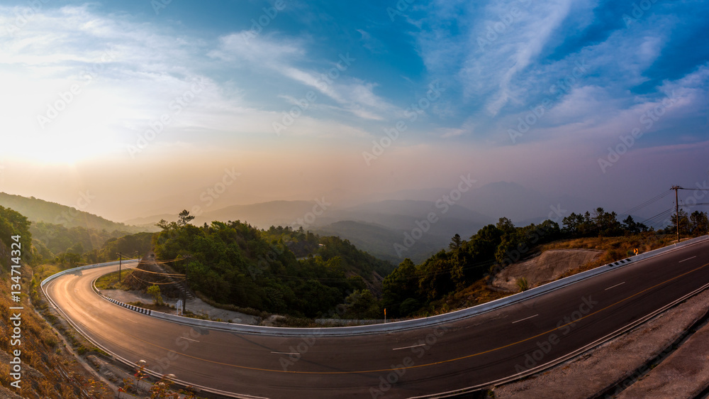 Doi Inthanon National park in the sunrise at Chiang Mai, Thailand with the curve of road.