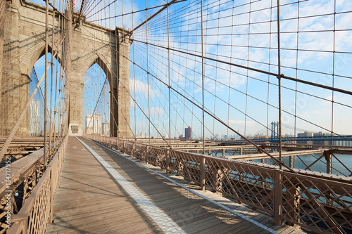Empty Brooklyn Bridge footpath in a sunny day  New York