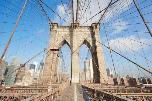 Brooklyn Bridge wide angle view in the morning sunlight, New York © andersphoto
