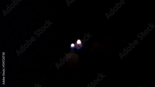 Lighting up the candle by matches in dark secne