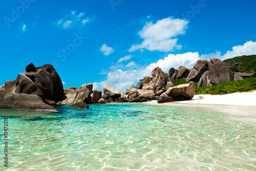 Natural pool on a tropical desert beach, Anse Marron, La digue, Seychelles