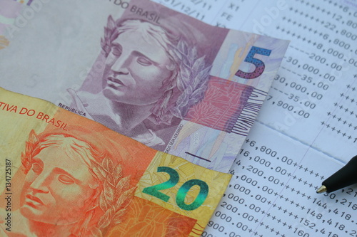 Wallpaper Mural Brazilian Real banknote on bank statement, saving investment concept Torontodigital.ca