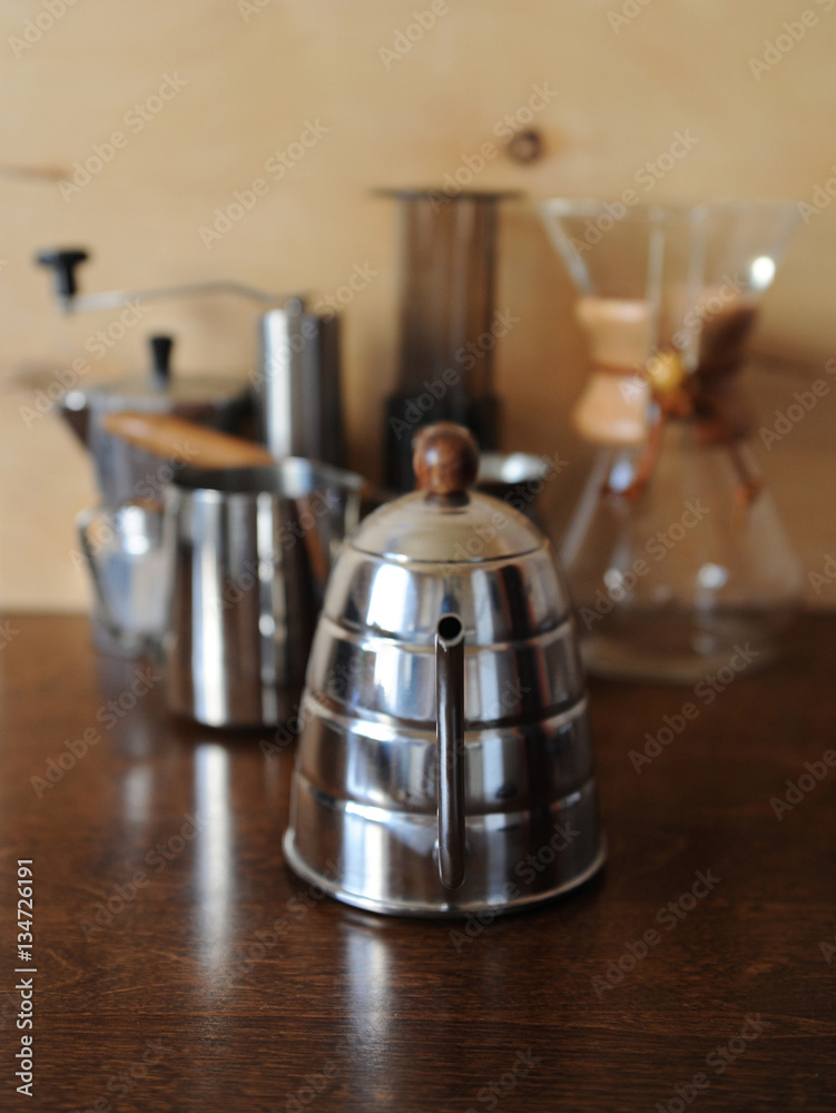 Objects for alternative coffee brewing on a wooden background Objects for alternative coffee brewing on a wooden background