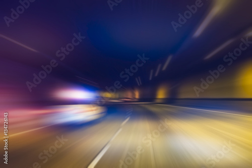police car with lighting while running in tunnel.-blurred.