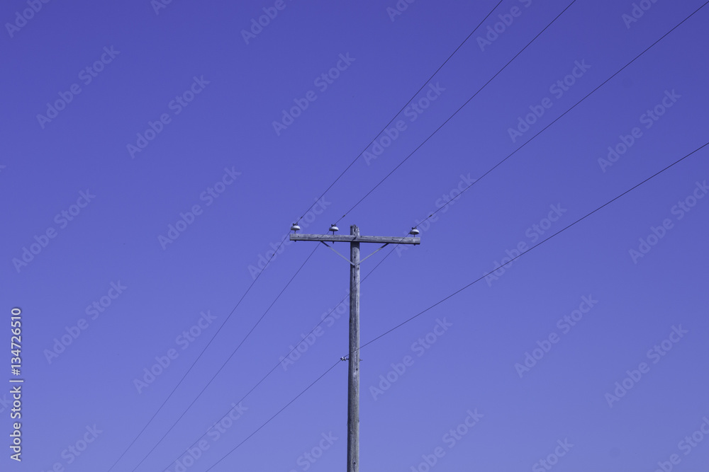 Telephone pole and blue sky