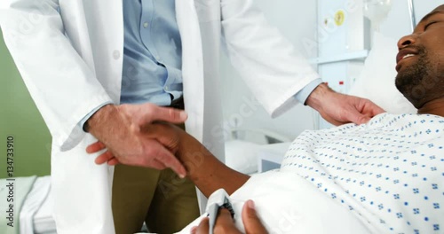 Wallpaper Mural Doctor shaking hands with patient in the hospital Torontodigital.ca