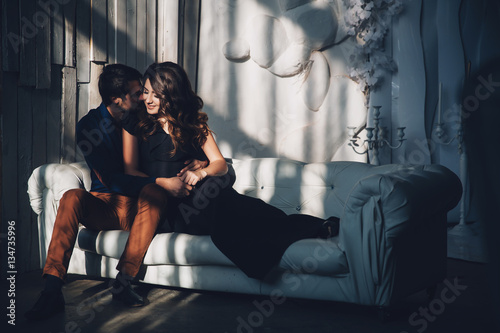 beautiful young couple in love hugging. Cute brunette girl and her boyfriend posing. Family concept