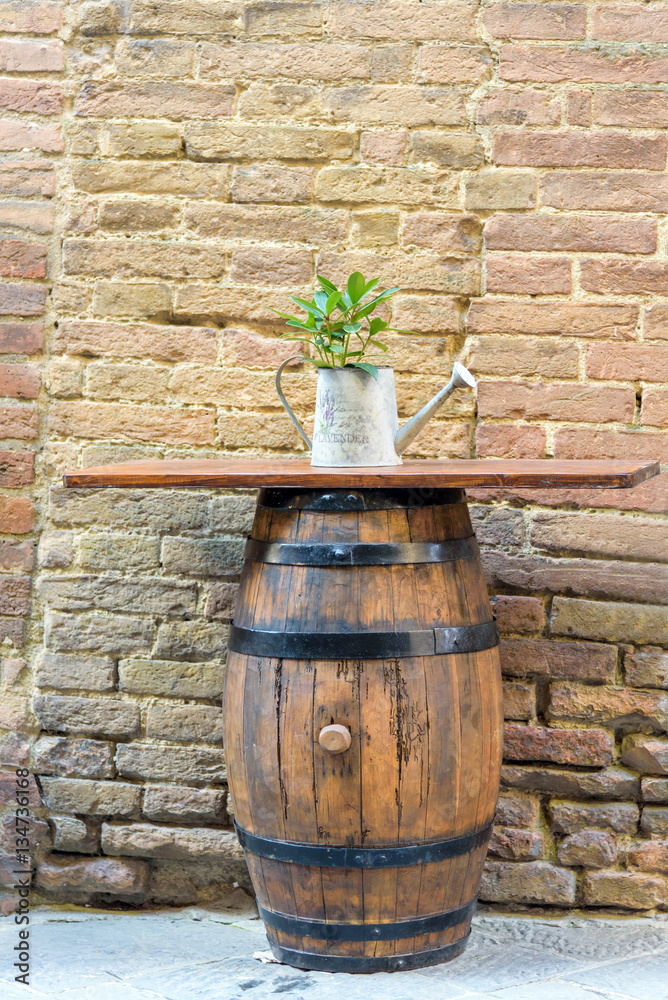 wooden barrel used as table on brick wall background wooden barrel used as table on brick wall background