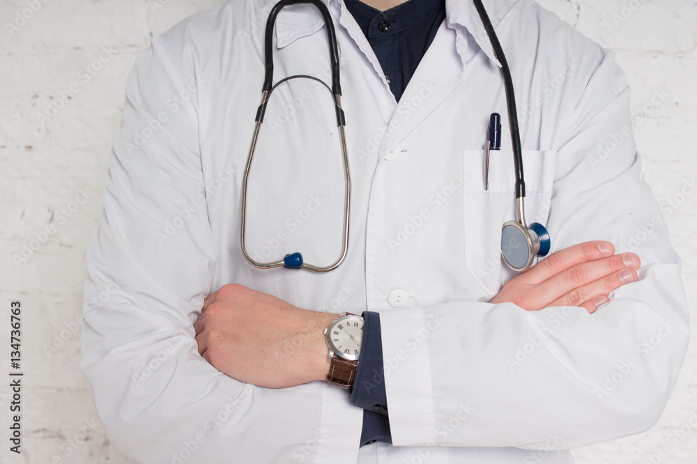 Closeup of doctor in lab coat with folded arms Closeup of doctor in lab coat with folded arms