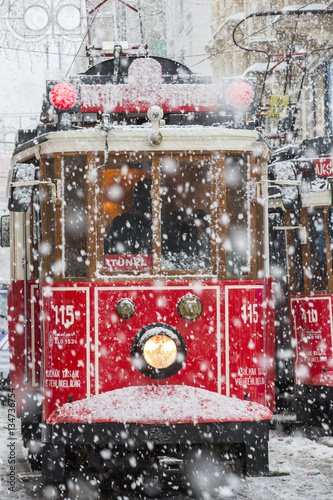 Tram under snow rain at Istiklal Street, Beyoglu, Turkey