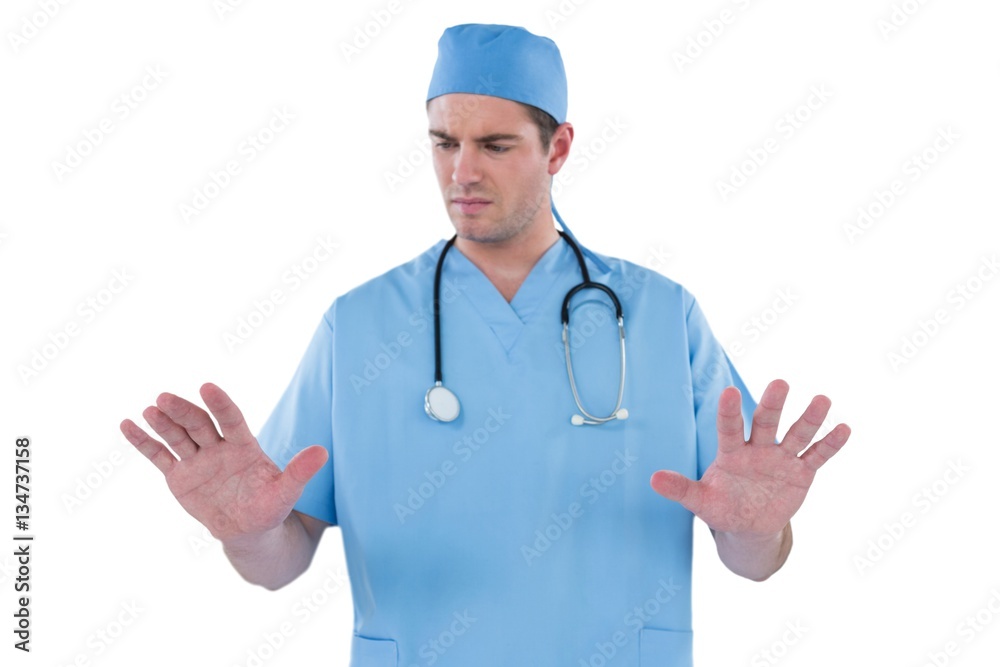 Surgeon pretending to be using futuristic digital screen Surgeon pretending to be using futuristic digital screen