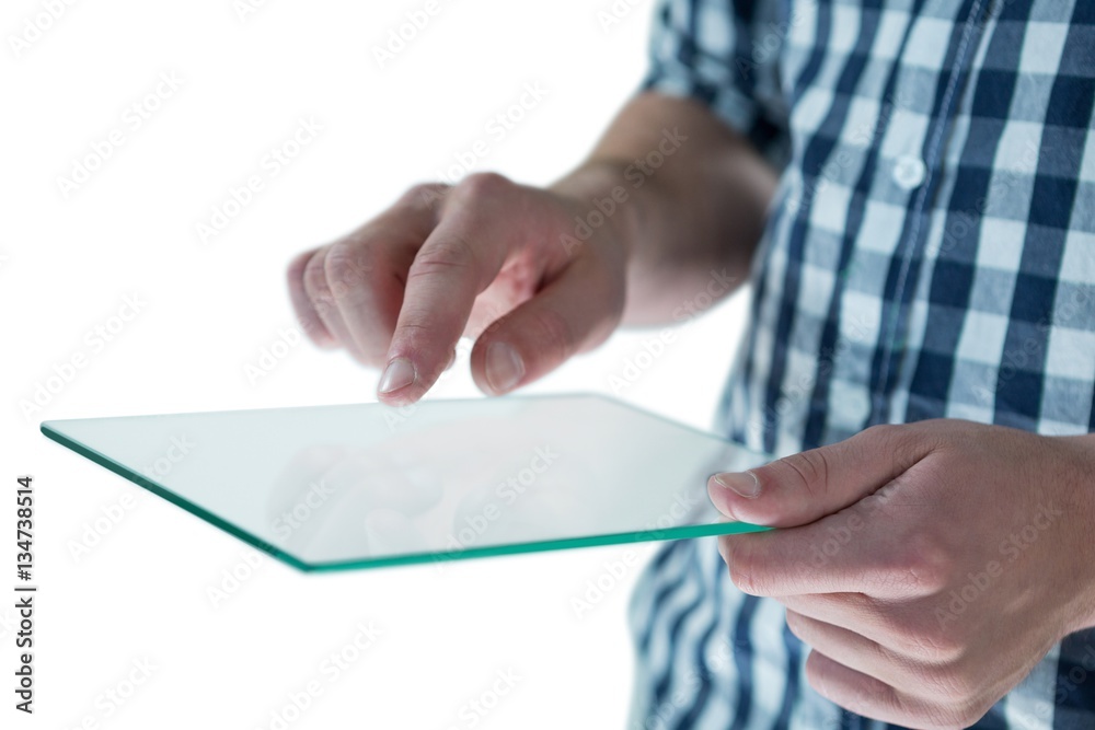 Mid section of man using futuristic digital tablet Mid section of man using futuristic digital tablet
