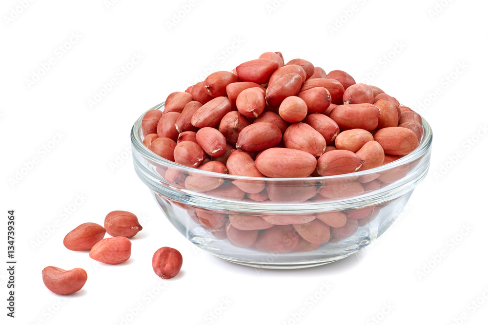 Peanuts in glass bowl on white Peanuts in glass bowl on white