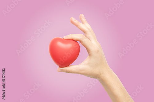 woman hand holding red heart