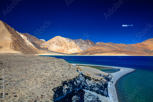 a beautiful mountain range naer pangong lake and a clearly sky