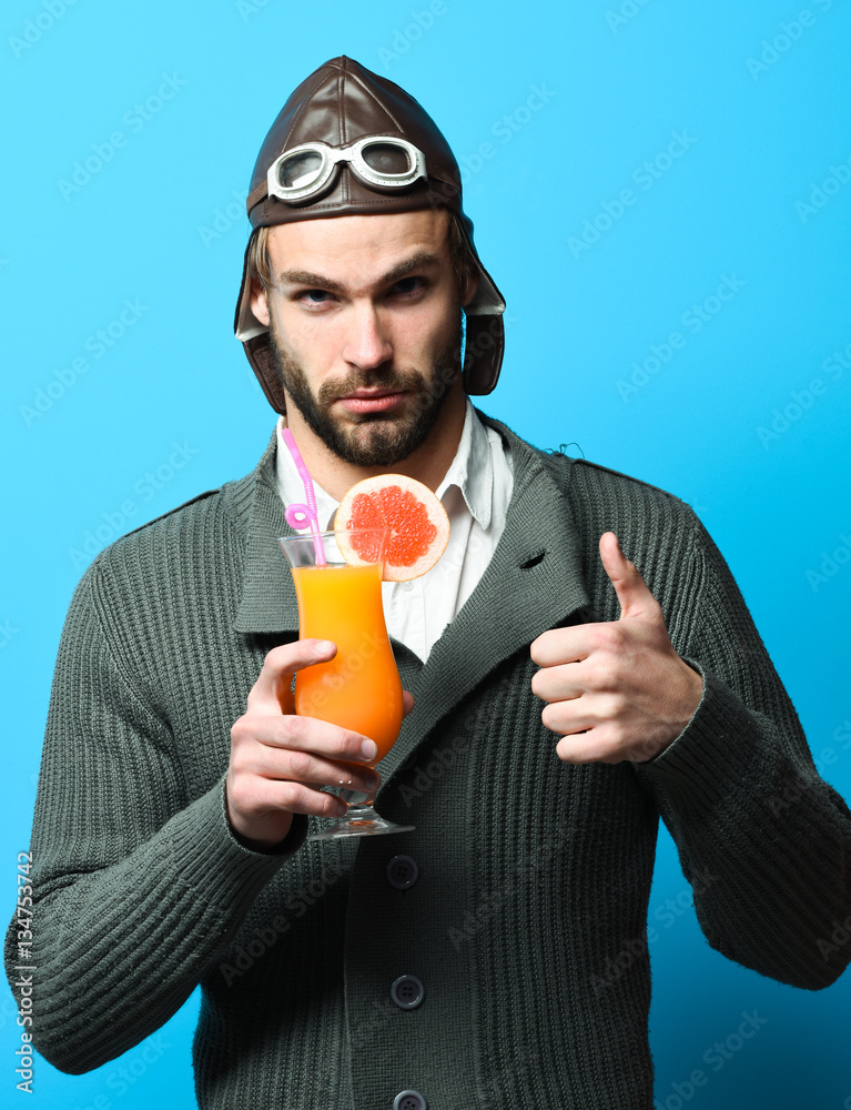Fototapeta premium bearded pilot with cocktail in glass