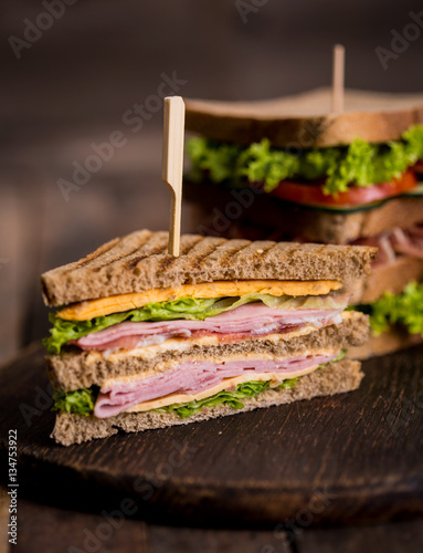 Club sandwiches with  ham, cheese, bacon and lettuce
