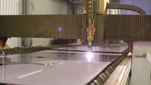 The Plasma Cutter Cutting A Piece Of Metal photo