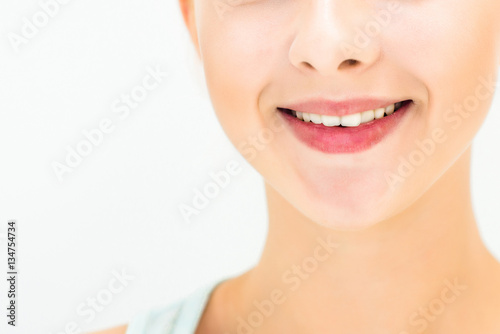 Close-up of smiling on a light background. Space for text