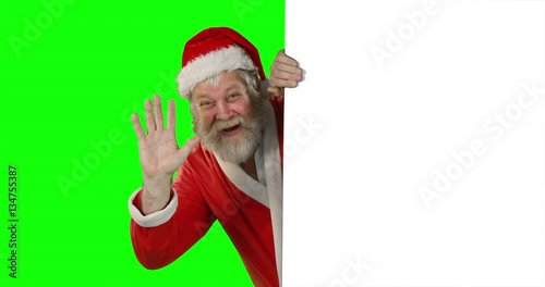 Surprised santa claus waving hand on green screen during christmas 4k