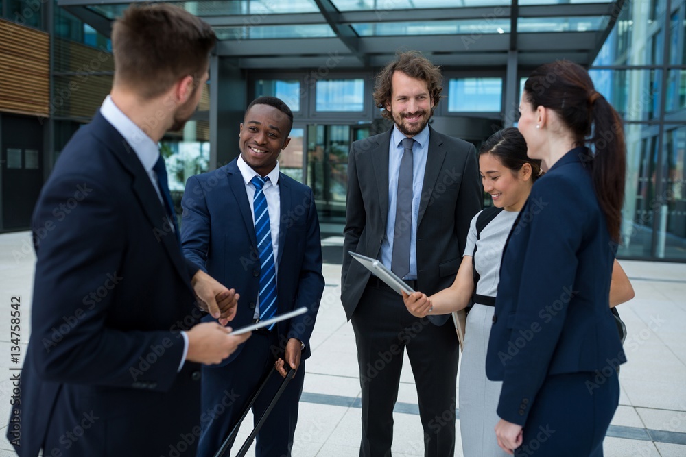 Group of businesspeople having a conversation Group of businesspeople having a conversation