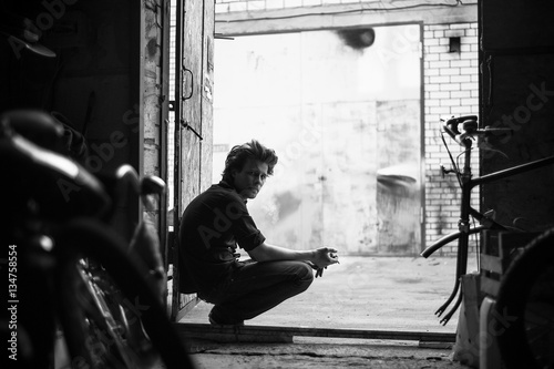 young boy mechanic in a garage