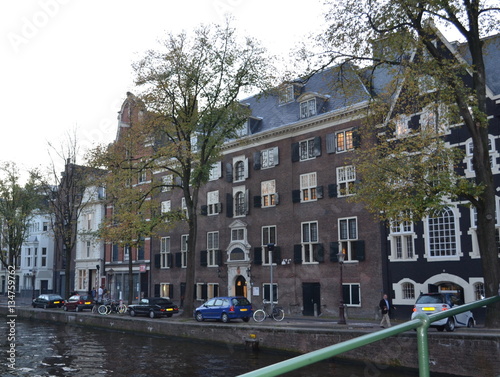 Houses on the water. Interesting Amsterdam. Canals of Amsterdam. Europe. photo