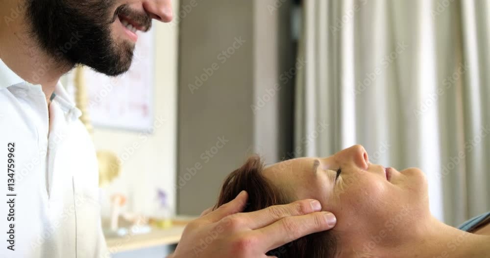 Physiotherapist giving head massage to a female patient in clinic 4k Physiotherapist giving head massage to a female patient in clinic 4k